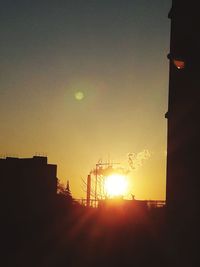 Low angle view of silhouette buildings against sky during sunset