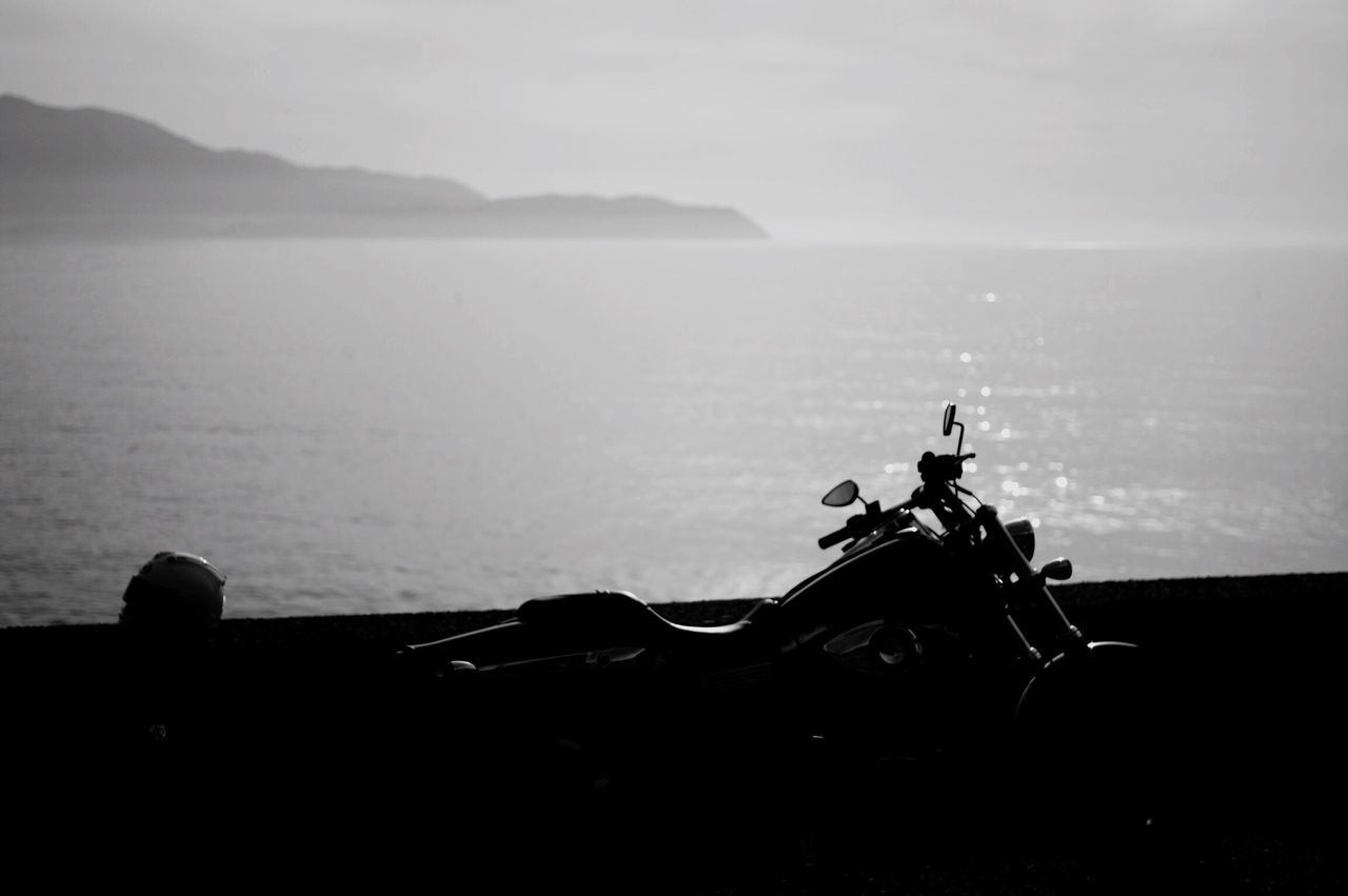 sea, water, horizon over water, sky, tranquility, silhouette, scenics, nature, tranquil scene, beauty in nature, nautical vessel, mode of transport, outdoors, transportation, idyllic, day, beach, boat, shore, no people