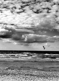 Scenic view of sea against cloudy sky
