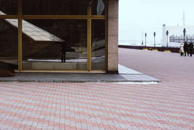 Sidewalk by building in city