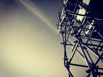 Low angle view of metallic structure against sky