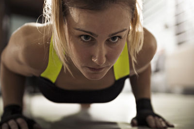 Woman doing push-ups in gym