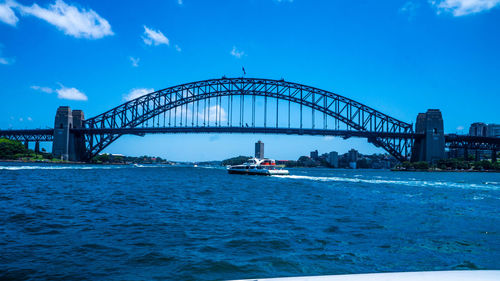 View of harbor bridge in city