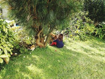 Rear view of two girls on grassy field