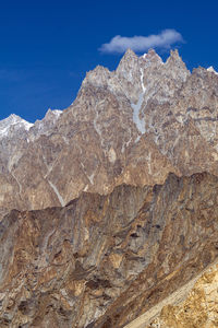 Scenic view of snowcapped mountains against clear blue sky