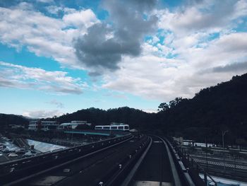 High angle view of road against cloudy sky