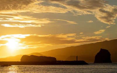 Sunset view from pico to faial, azores islands, atlantic ocean.