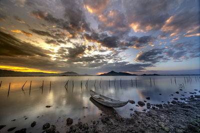 Scenic view of sea against sky at sunset