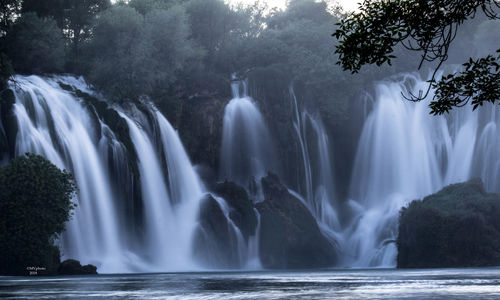 View of waterfall in forest