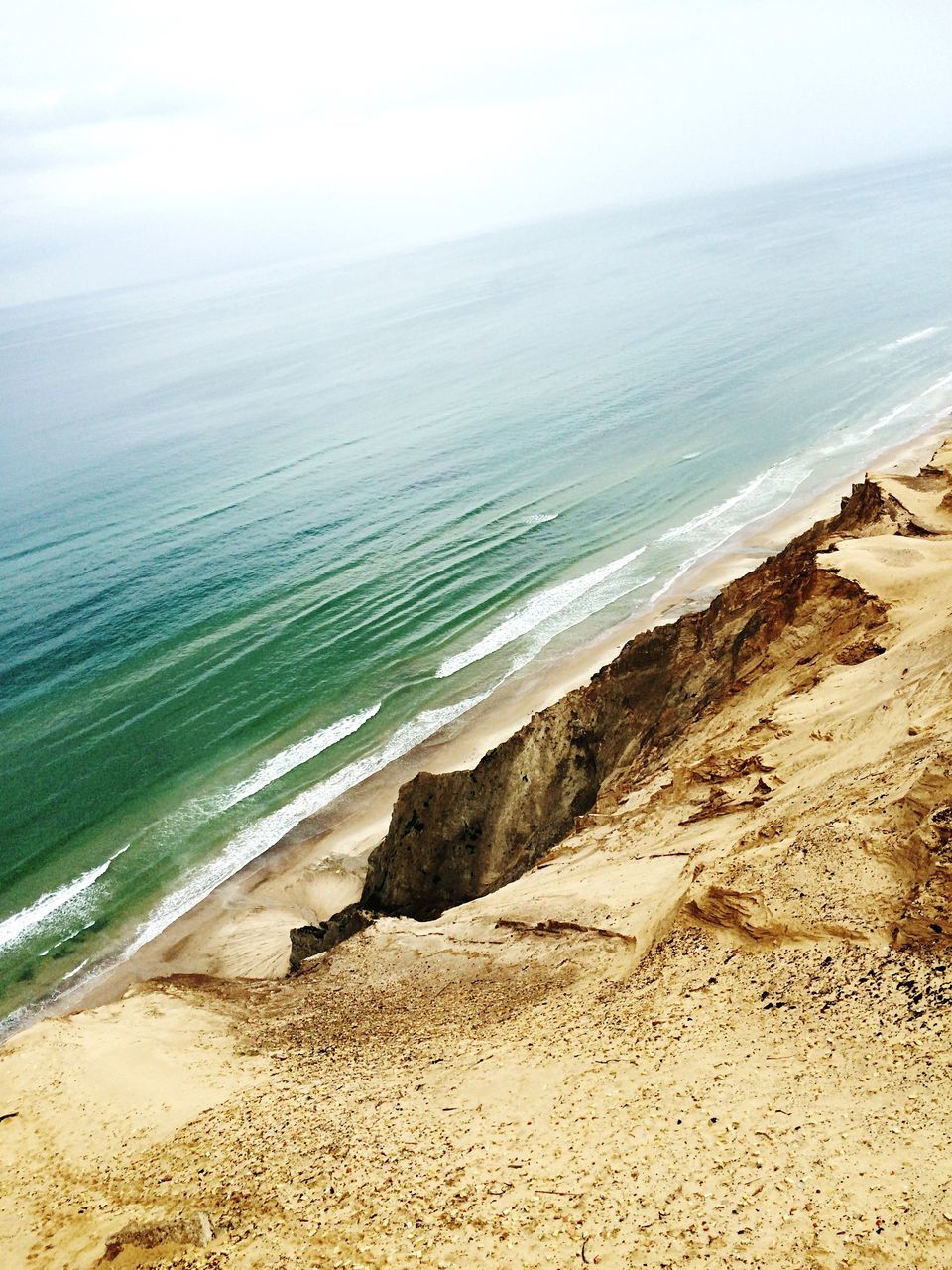 sea, horizon over water, beach, water, shore, sand, scenics, tranquil scene, tranquility, beauty in nature, sky, wave, nature, coastline, idyllic, seascape, remote, outdoors, day, no people, non-urban scene, blue