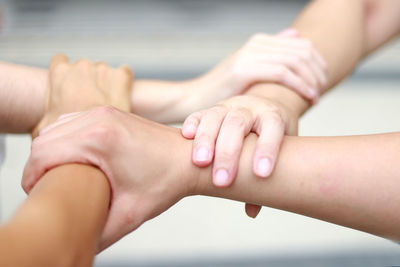 Close-up of people holding hands