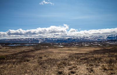 Scenic view of snowcapped mountains against sky