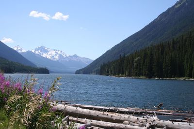 Scenic view of lake and mountains against sky
