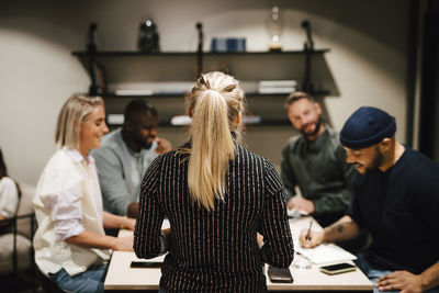 Coworkers having meeting in office