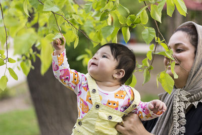 Cute girl and plants outdoors