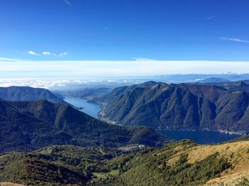 Scenic view of mountains against blue sky