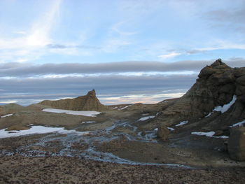 Scenic view of sea against cloudy sky