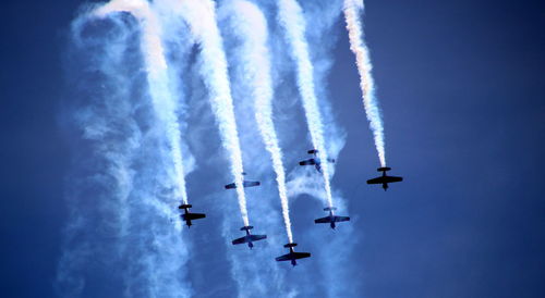 Low angle view of airplane flying in sky