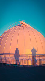 A couple of shadows on an observatory dome