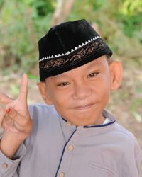 Portrait of smiling boy wearing hat