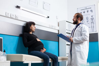 Side view of doctor working at clinic