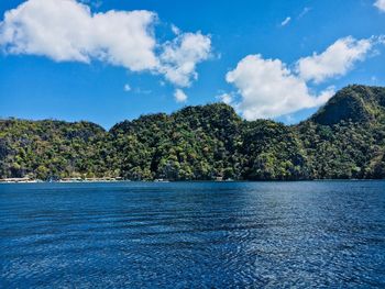 Scenic view of lake against blue sky