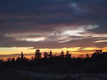 Scenic view of dramatic sky during sunset