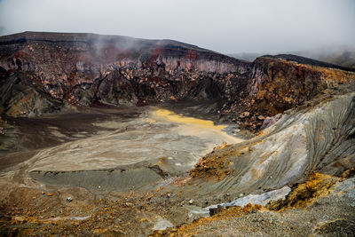 Volcano crater with yellow sulfur of aso mountain in kyushu, japan