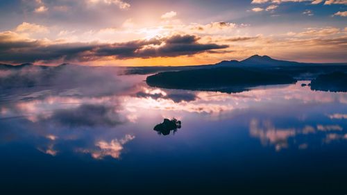 Scenic view of lake against sky during sunset