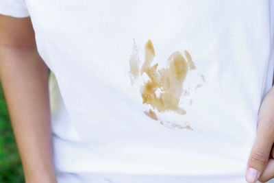 Midsection of woman holding ice cream