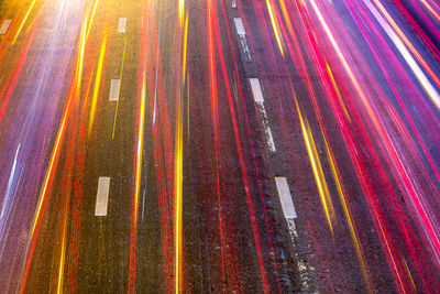 High angle view of light trails on road