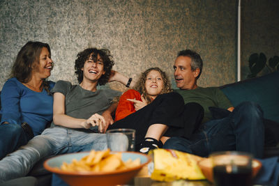 Group of people sitting on sofa