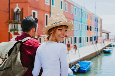 Portrait of people on boat in canal