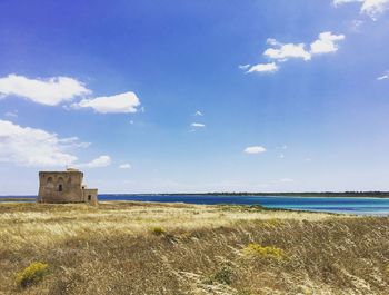 Scenic view of sea against cloudy sky