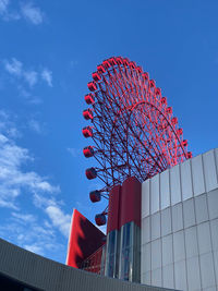 Low angle view of skyscraper against clear blue sky