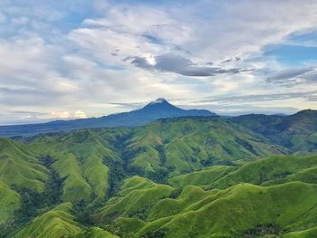 High angle view of mountain range against cloudy sky