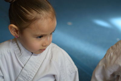 Girl sitting at karate classes