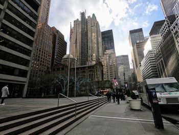 Modern buildings in city against sky