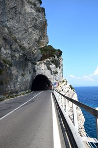 Road by sea against sky