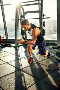 Low section of woman exercising in gym