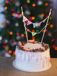 Birthday cake with blurry colorful lights