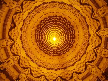 Low angle view of illuminated ceiling