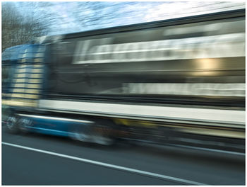 Blurred motion of car on road