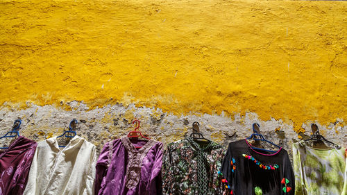  multicolored clothes hanging on the wall