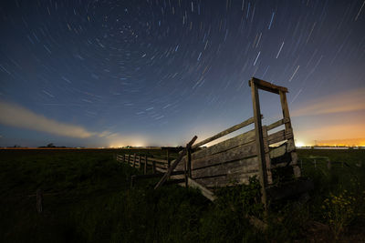 Scenic view of field against sky at night
