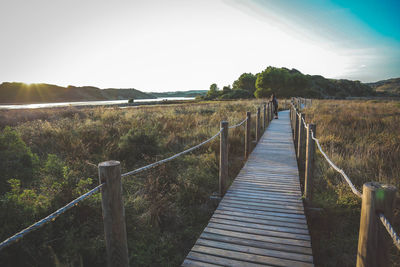 View of jetty leading to sea