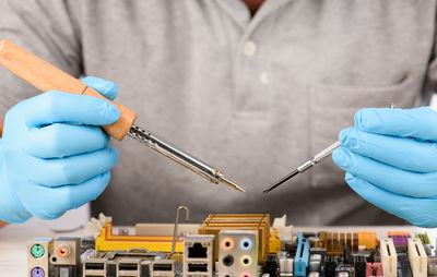 Close-up of engineer repairing circuit board