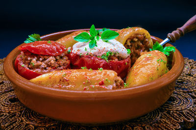 Stuffed bell pepper in bowl on table