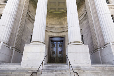 Monumental staircase and entrance to historic courthouse in old montreal