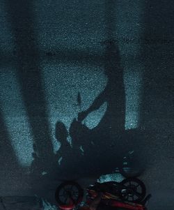 High angle view of silhouette shadow on floor